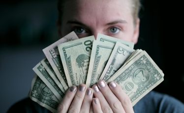 woman holding banknotes